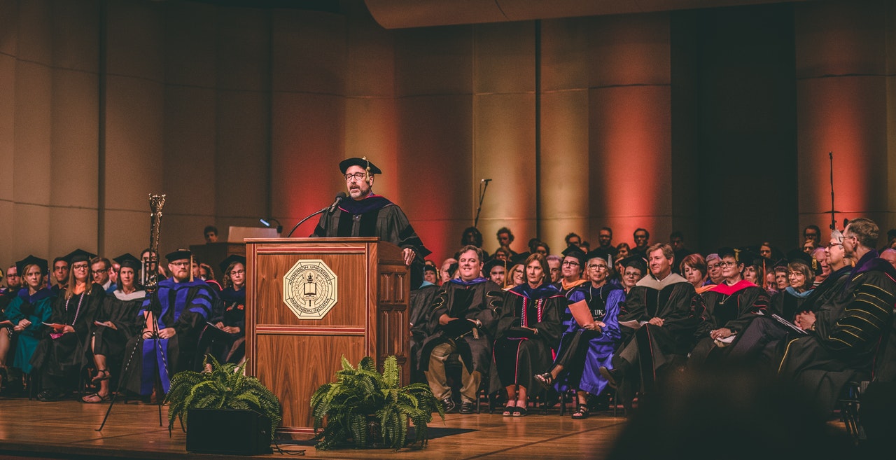 delivering a speech in a graduation ceremony